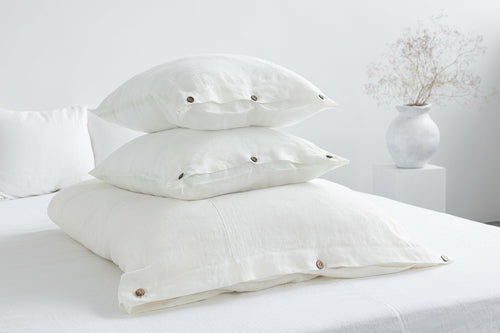 White linen bedding set with coconut buttons